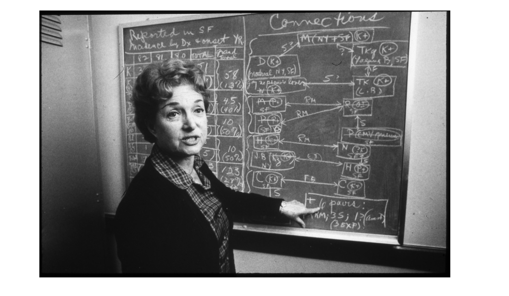 Selma Dritz in front of a chalkboard, 1982.