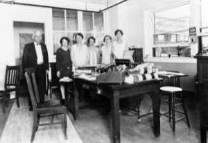 Riley J. Warren, left, with staff and daughter Beatrice Blanding, far right. (date unknown)